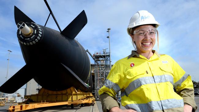 ASC rolled out HMAS Farncomb from the maintenance shed in 2015 with the help of mechanical fitter Deb Spence. Picture: Tricia Watkinson