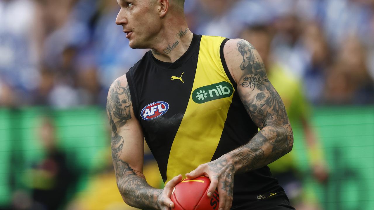 MELBOURNE, AUSTRALIA - AUGUST 19: Dustin Martin of the Tigers looks to pass the ball during the round 23 AFL match between Richmond Tigers and North Melbourne Kangaroos at Melbourne Cricket Ground, on August 19, 2023, in Melbourne, Australia. (Photo by Daniel Pockett/Getty Images)