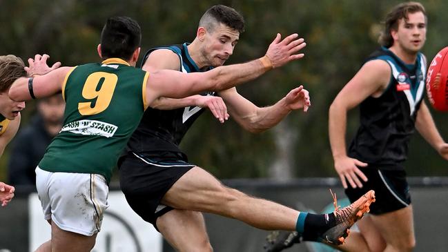 Luke Wilson gets a kick for Laurimar. Picture: Andy Brownbill