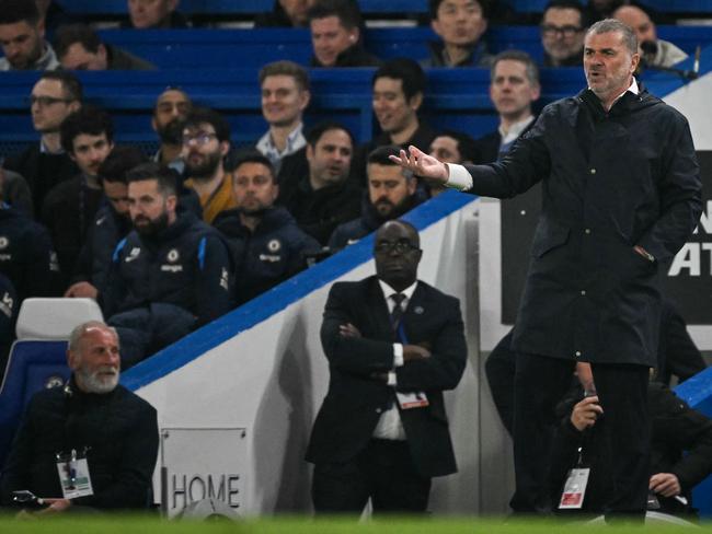 Tottenham Hotspur's Greek-Australian Head Coach Ange Postecoglou reacts during the English Premier League football match between Chelsea and Tottenham Hotspur at Stamford Bridge in London on April 3, 2025. (Photo by Glyn KIRK / AFP) / RESTRICTED TO EDITORIAL USE. No use with unauthorized audio, video, data, fixture lists, club/league logos or 'live' services. Online in-match use limited to 120 images. An additional 40 images may be used in extra time. No video emulation. Social media in-match use limited to 120 images. An additional 40 images may be used in extra time. No use in betting publications, games or single club/league/player publications. /