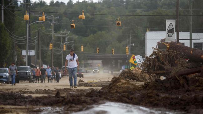 A resident walks down the street in Old Fort, North Carolina, as residents begin sharing stories of the horrors they’ve witnessed in the aftermath. Picture: Getty Images via AFP