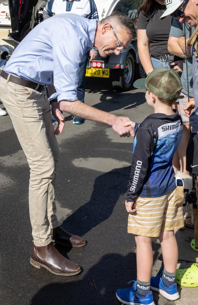 Dominic Perrottet meets locals at a boat ramp on the Nepean on Saturday. Picture: Christian Anstey