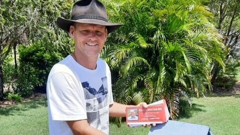 Division 3 councillor candidate Grant Mathers doing letterbox drops during his campaign.