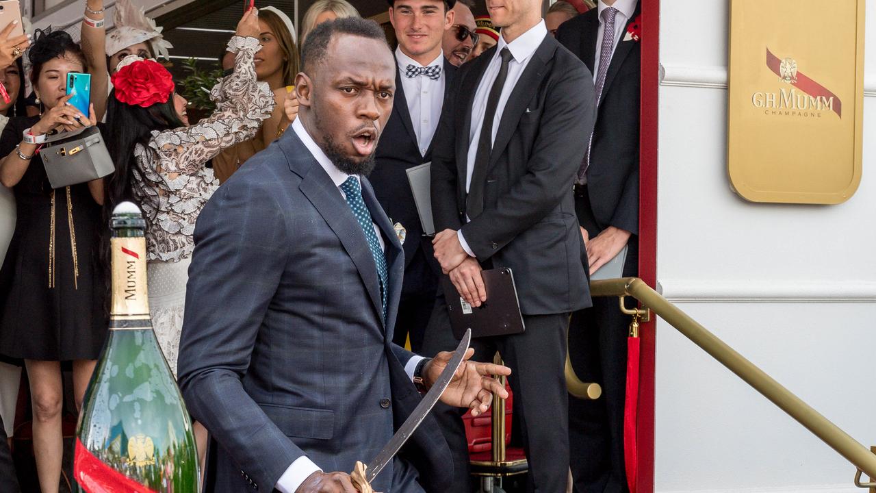 Usain Bolt performs the Mumm tap challenge. Picture: Jake Nowakowski