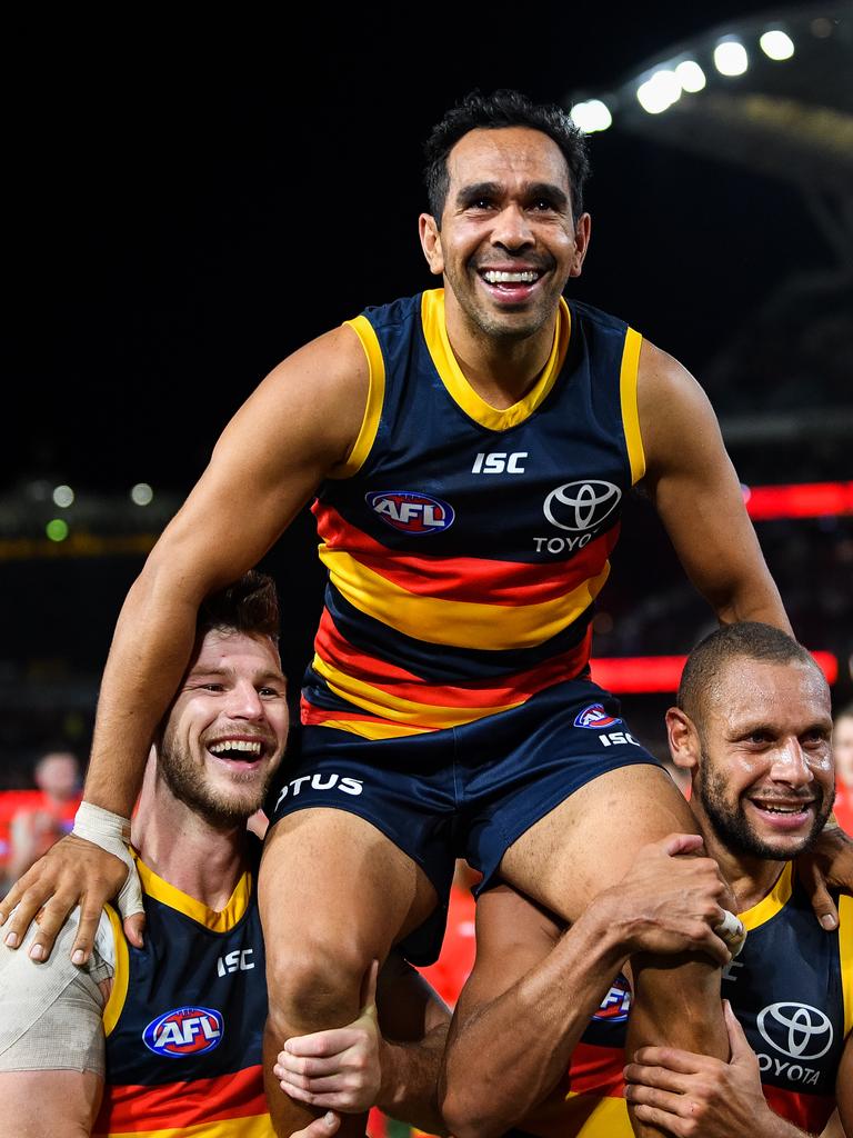 Eddie Betts is chaired from the ground by Crows Bryce Gibbs and Cam Ellis-Yolmen. Picture: Daniel Kalisz