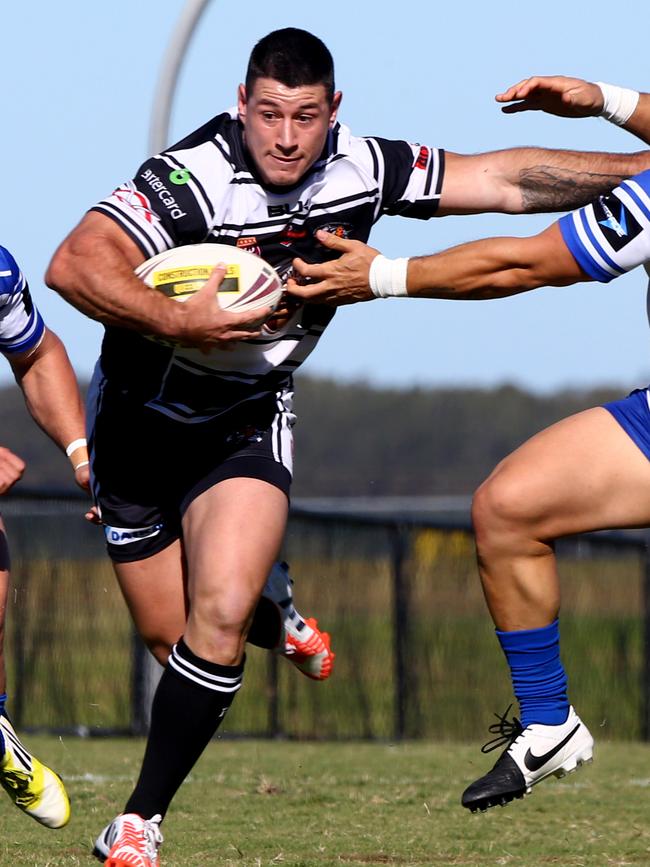 Coast 2 Coast Cup rugby league at Tugun. Tugun Seahawks v Tweed Heads Seagulls. Tweeds #4 Tim Cassidy palms off Tuguns #3 Tim Matenga. Photo: Kit Wise