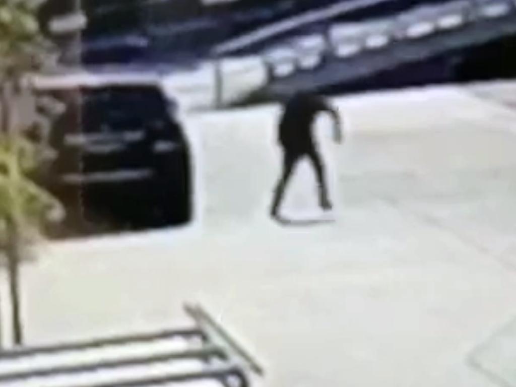 The gunman runs from the car after shooting Mick Hawi outside the Rockdale Fitness First. Picture: Supplied