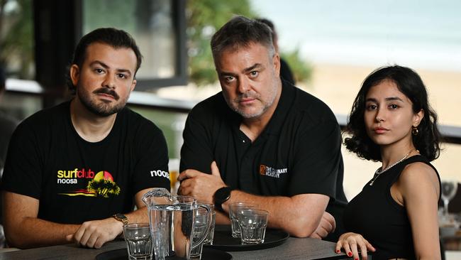 Ian Pratt of Lexis Training with international students Bautista Crescimbeni, 25, from Argentina and Nina Irmak, 26, from Turkey at the Noosa Surf Club on the Sunshine Coast. Picture: Lyndon Mechielsen/The Australian