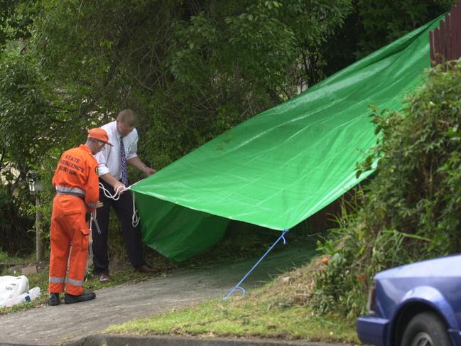 Police officers searching for clues in Point Clare.