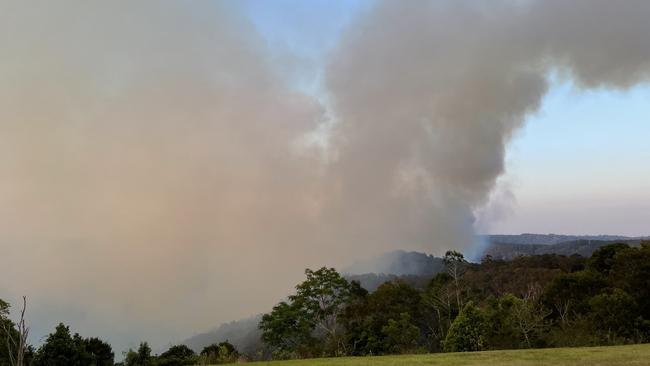 Firefighters are battling a large bushfire at Obi Obi, with residents told at 4.38pm on Tuesday to prepare to leave.