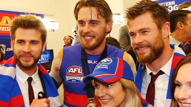 Jordan Roughead of the Bulldogs celebrates the win with Chris Hemsworth and brother Liam after the 2016 AFL Grand Final. Picture: Darrian Traynor/Getty