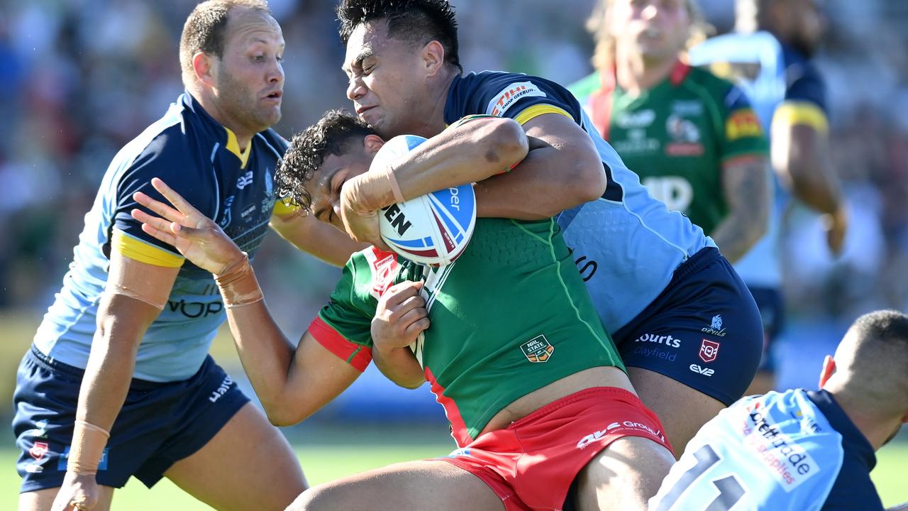 Selwyn Cobbo is wrapped up by the North defence during the Intrust Super Cup grand final. Picture: Bradley Kanaris/Getty Images