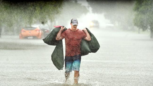 Heavy rain lashes Townsville causing flash flooding. Peter Sharpe in Carmody Street, Rosslea. Picture: Evan Morgan