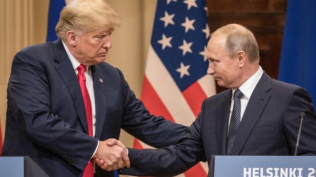 HELSINKI, FINLAND - JULY 16: U.S. President Donald Trump (L) and Russian President Vladimir Putin shake hands during a joint press conference after their summit on July 16, 2018 in Helsinki, Finland. The two leaders met one-on-one and discussed a range of issues including the 2016 U.S Election collusion.  (Photo by Chris McGrath/Getty Images)