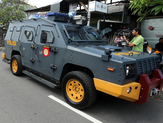 Police officers arrive at the Bali Parole office in Denpasar to prepare for Schapelle Corby to report one last time before she is transported to the airport by Indonesian Immigration for deportation to Australia. Pic Nathan Edwards. Pic Nathan Edwards