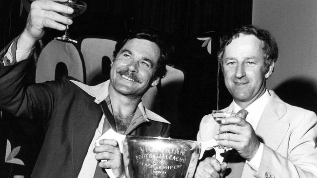 Ron Barassi and North Melbourne president Lloyd Holyoak with the 1977 premiership cup.