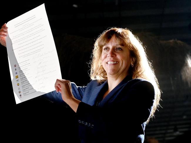 Rachel Perkins holds aloft the signatures of   peak religious institutions, calling on Australian political leaders to take action on a First Nations Voice Referendum, as advocated by the Uluru Statement from the Heart at The Cutaway in Barangaroo, Sydney. Photo Jeremy Piper