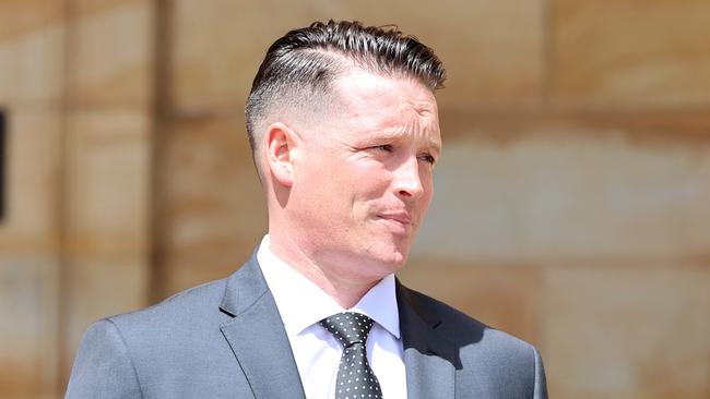 Police officer Sean Hobbs outside the Adelaide Magistrates Court on Monday. His trial has heard he allegedly choked a 17-year-old as he lay on the ground, allegedly after the youth was knocked down by fellow police officer Andrew Jaunay. Picture: Kelly Barnes