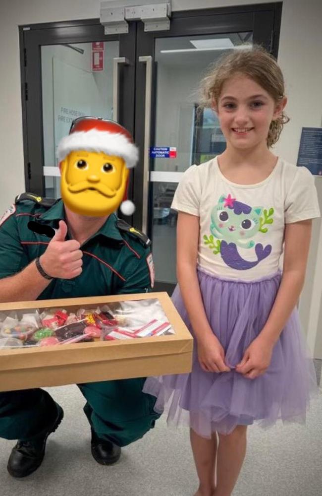 Blain MLA Mark Turner took his seven-year-old daughter Erin with him on his visit to frontline staff on Christmas Day. Picture: Mark Turner