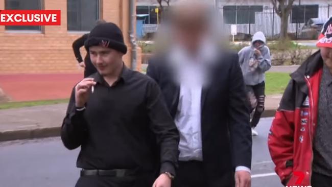 The teen hoon, centre, outside the Elizabeth courthouse. Picture: 7NEWS