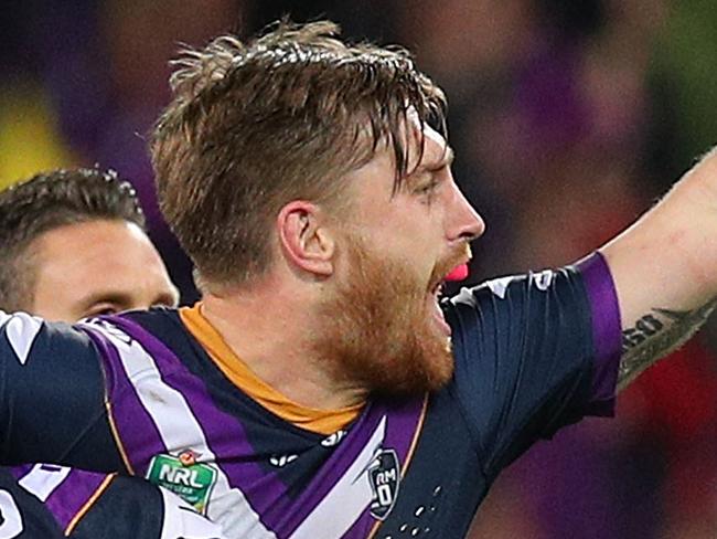 MELBOURNE, AUSTRALIA - SEPTEMBER 07:  Cameron Munster of the Storm celebrates kicking a drop goal during the NRL Qualifying Final match between the Melbourne Storm and the South Sydney Rabbitohs at AAMI Park on September 7, 2018 in Melbourne, Australia.  (Photo by Graham Denholm/Getty Images)