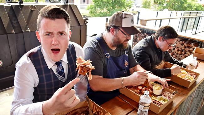 Hills Shire Times reporters Jake McCallum (left) Gary Hamilton-Irvine (right) take on chef Brad Shorten in the Brimstone Feast challenge at Castle Hill. Picture: AAP IMAGE / Troy Snook