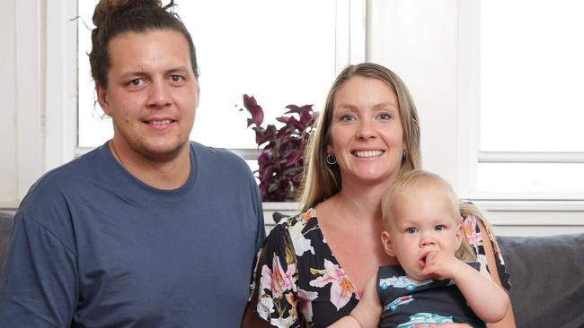 Andrew Cameron, 32, wife Kylie Cameron, 30, and son Oliver, 1 year old, pictured at their house in Waverley. They recently purchased their first investment property. Picture: Christian Gilles.