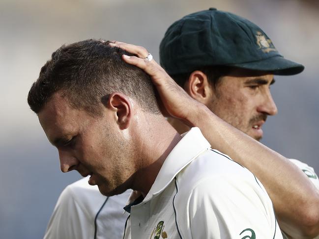 PERTH, AUSTRALIA - DECEMBER 13: Josh Hazlewood of Australia is consoled by Mitchell Starc of Australia as he leaves the ground with an injury during day two of the First Test match between Australia and New Zealand at Optus Stadium on December 13, 2019 in Perth, Australia. (Photo by Ryan Pierse/Getty Images)