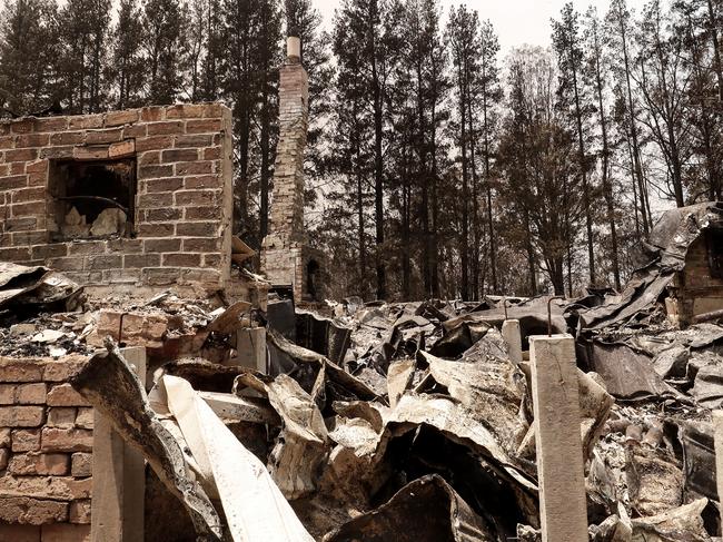 ORBOST, AUSTRALIA - JANUARY 04: Debris of a burnt house are seen on January 04, 2020 in Sarsfield, Australia. Two people are dead and 28 remain missing following bushfires across the East Gippsland area, with Victorian premier Daniel Andrews declaring a state of disaster in the region. Thousands of people remain stranded in the coastal town of Mallacoota and are being evacuated by navy ships to Melbourne. (Photo by Darrian Traynor/Getty Images)