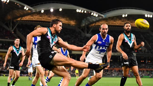 Port Adelaide’s Travis Boak unloads against North Melbourne at Adelaide Oval. Picture by Daniel Kalisz/Getty Images.