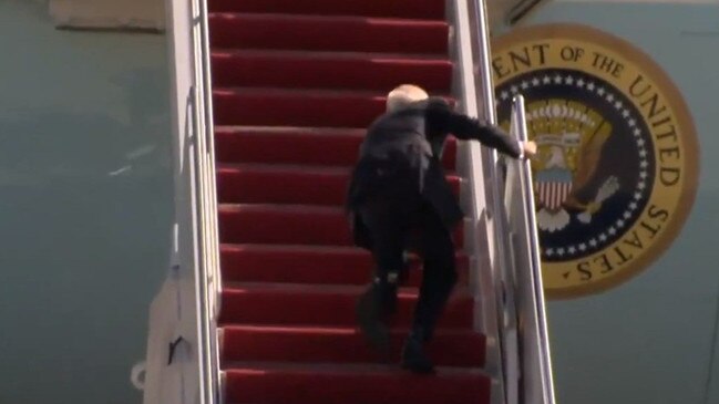 Biden stumbling as he climbs on to Air Force One.