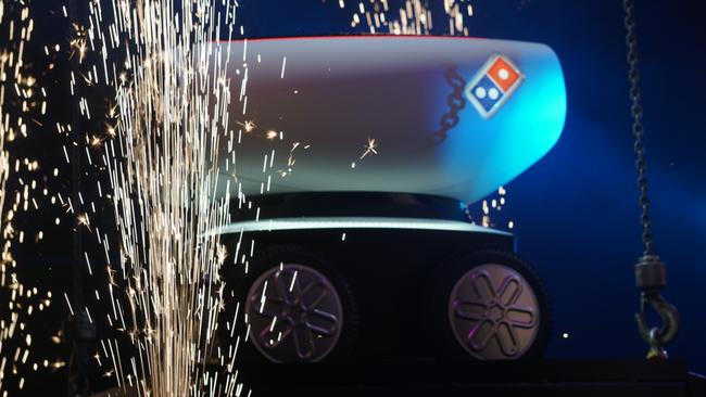 Pizza with pizzazz: DRU is lowered from the sky amid sparklers at Domino's Gala Night in Brisbane