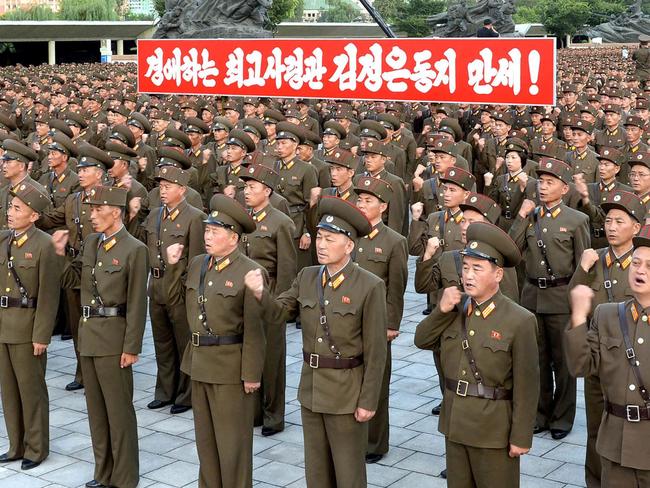 This picture taken on August 10, 2017 and released by North Korea's official Korean Central News Agency (KCNA) on August 11, 2017 shows service personnel of the Ministry of People's Armed Forces at a rally in support of North Korea's stance against the US, at the fatherland liberation war victory monument and education square in Pyongyang.  / AFP PHOTO / KCNA VIA KNS / STR / South Korea OUT / REPUBLIC OF KOREA OUT   ---EDITORS NOTE--- RESTRICTED TO EDITORIAL USE - MANDATORY CREDIT "AFP PHOTO/KCNA VIA KNS" - NO MARKETING NO ADVERTISING CAMPAIGNS - DISTRIBUTED AS A SERVICE TO CLIENTS THIS PICTURE WAS MADE AVAILABLE BY A THIRD PARTY. AFP CAN NOT INDEPENDENTLY VERIFY THE AUTHENTICITY, LOCATION, DATE AND CONTENT OF THIS IMAGE. THIS PHOTO IS DISTRIBUTED EXACTLY AS RECEIVED BY AFP.    /