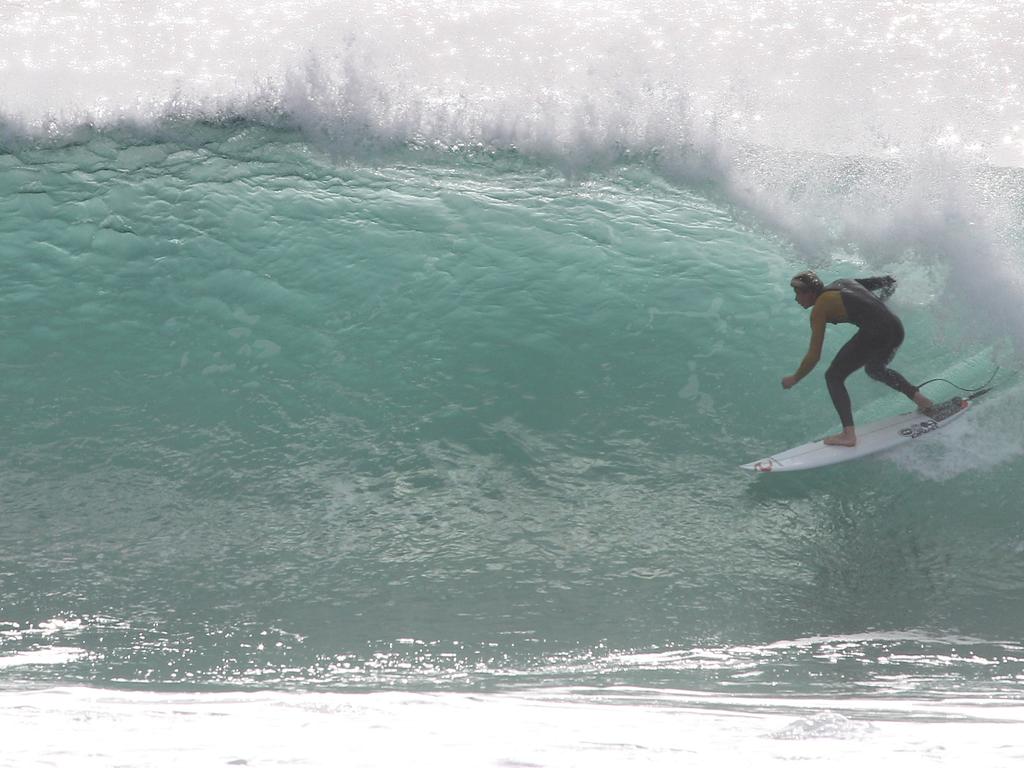 Surfers pictured enjoying good swell and near perfect waves at Snapper Rocks. Picture: Mike Batterham