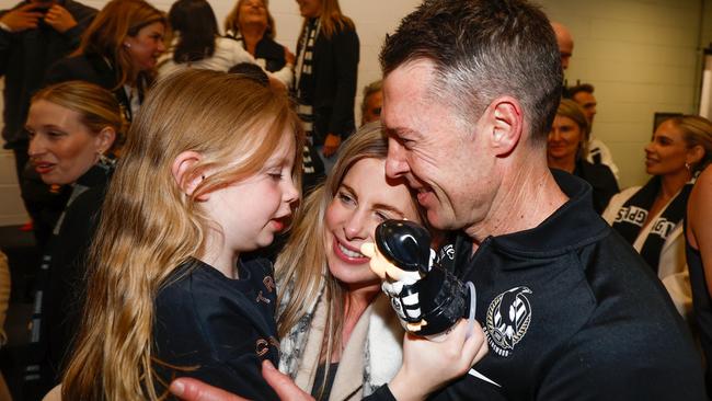 Craig McRae and wife Gabrielle with his daughter Charlie. The Collingwood coach is expecting his third child in mid October. Picture: Michael Willson/AFL