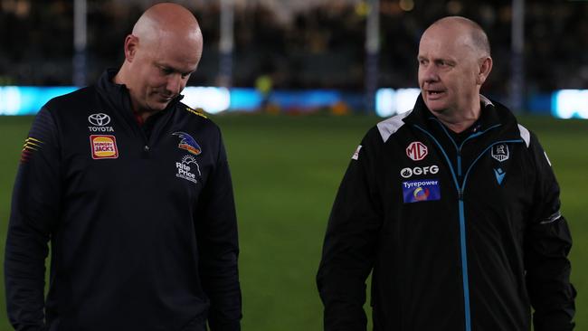 ADELAIDE, AUSTRALIA - AUG 17: Matthew Nicks, Senior Coach of the Crows talks to Ken Hinkley, Senior Coach of the Power during the 2024 AFL Round 23 match between the port Adelaide Power and the Adelaide Crows at Adelaide Oval on August 17, 2024 in Adelaide, Australia. (Photo by James Elsby/AFL Photos via Getty Images)