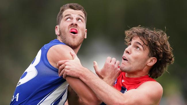 Tristan Xerri of the Kangaroos (left) competes for the ball against Austin Bradtke of the Demons. Picture: AAP Image/Michael Dodge