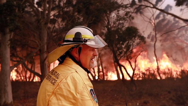 A large fire is burning out of control in the small country area of Bombay, NSW just outside of Braidwood in NSW. RFS volunteers from Carwoola protect property. Picture Gary Ramage