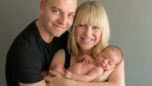 ‘I feel very lucky to be doing this’: Stay-at-home dad Paul Clarke, with wife Victoria and baby William. Picture: Supplied/Elena Nikolova