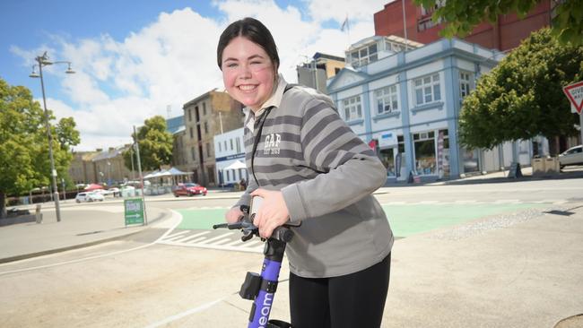 Breaking News Breaking News ZOOM: Grace Burbury tries out the new e-scooters. Picture: Kenji Sato