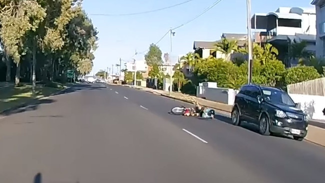 Hervey Bay motorcyclist falls to the ground after colliding with a car. Pic: Facebook