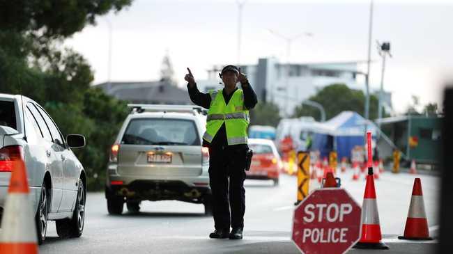 Queensland border remains closed, police checking cars as they cross the border. Picture: NIGEL HALLETT