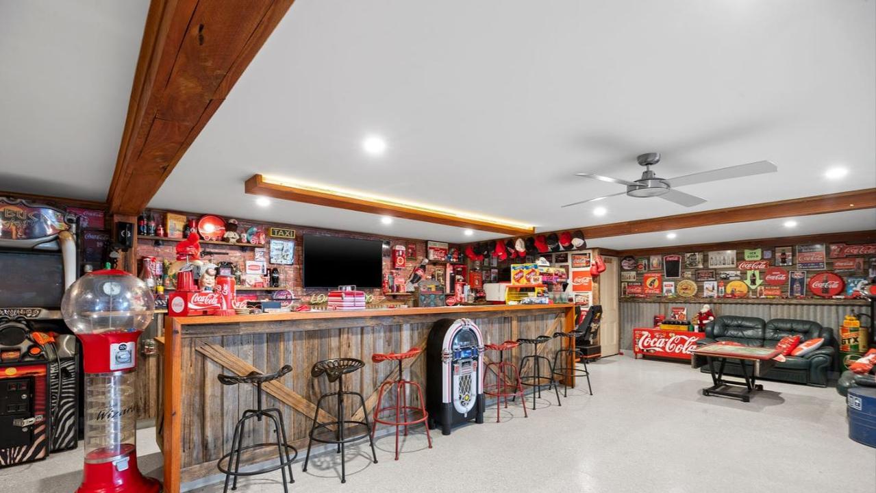 The ultimate bloke’s dream: Whether it’s arcade games or a full-fledged office set-up this man cave can handle it all.