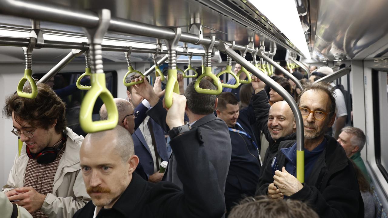 Pictured at Sydenham Station are the first passengers on the brand new Sydney Metro on its maiden run to Tallawong at 4.54am. Picture: Richard Dobson / Newswire