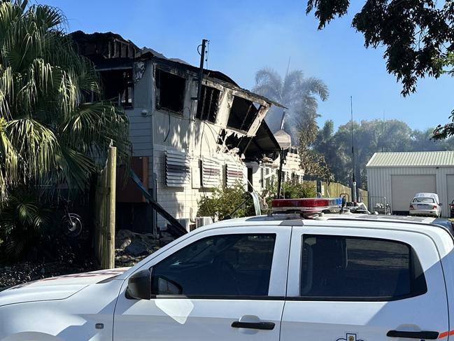 Police set up a crime scene at Barnacles Backpackers in Bowen after a fire engulfed the building, April 30, 2025