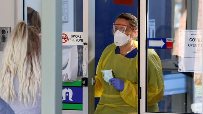 A nurse speaks with patients at the door of the new Covid-19 Clinic at the Mount Barker Hospital. Picture: AAP/Kelly Barnes