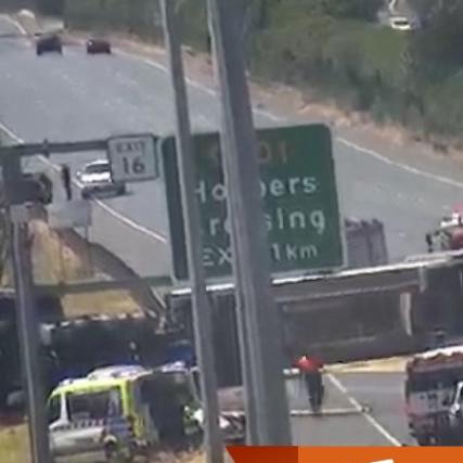 Paramedics transported two patients at the scene of a truck rollover at Point Cook on the Princes Freeway on Monday. Picture: VicTraffic