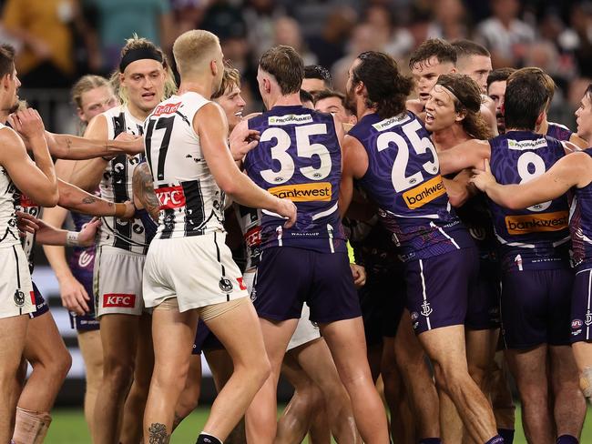 PERTH, AUSTRALIA - MAY 24: Team mates get involved as Brayden Maynard of the Magpies and Nat Fyfe of the Dockers wrestle during the round 11 AFL match between Walyalup (the Fremantle Dockers) and Collingwood Magpies at Optus Stadium, on May 24, 2024, in Perth, Australia. (Photo by Paul Kane/Getty Images)