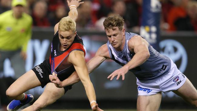 Essendon's Orazio Fantasia battles at ground level with Port Adelaide co-captain Tom Jonas. Picture: Michael Klein