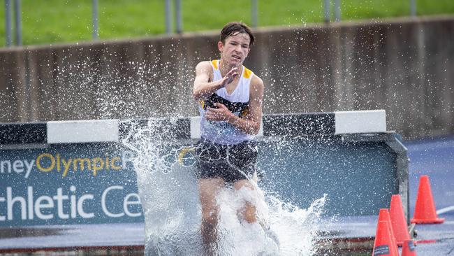 Isaac Beecroft from Quakers Hill in the steeplechase at the NSW Juniors.